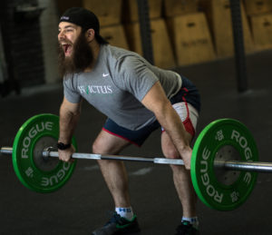 Invictus Olympic Weightlifing Program coach, Jared Enderton, pulling a snatch off the floor.