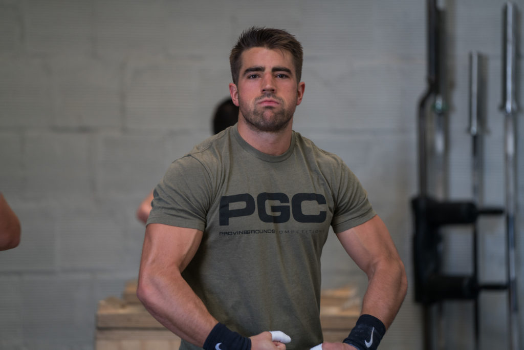 Male athlete making a tough guy face while doing a classic body building pose.