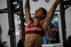 Female athlete on pull-up bar.
