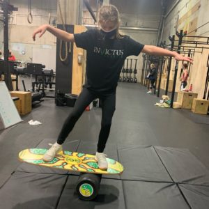 Teen athlete on a balance board.