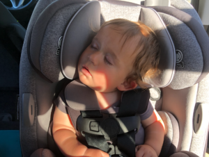 Cute Invictus baby sleeping in his car seat.