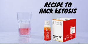 Ketone-IQ box next to drink made from the supplement.
