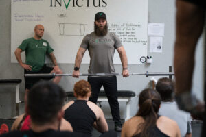 Coach Jared Enderton demonstrating making contact with the barbell