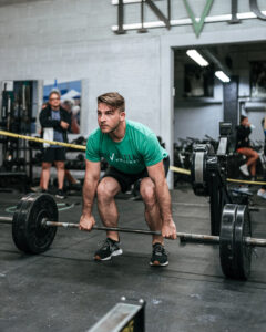 An athlete doing a deadlift in the gym